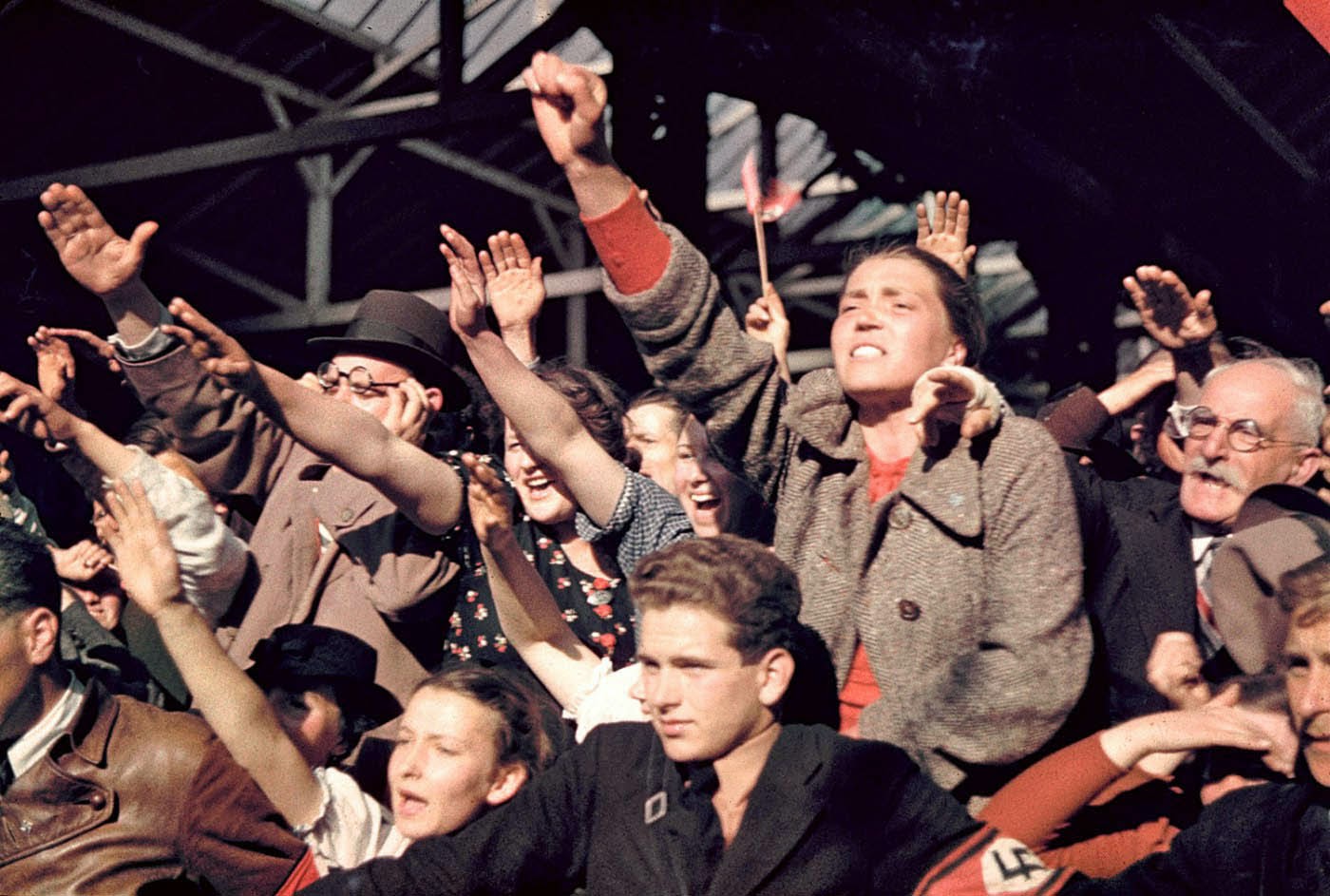Crowds cheering Adolf Hitler's campaign to unite Austria and Germany, 1938