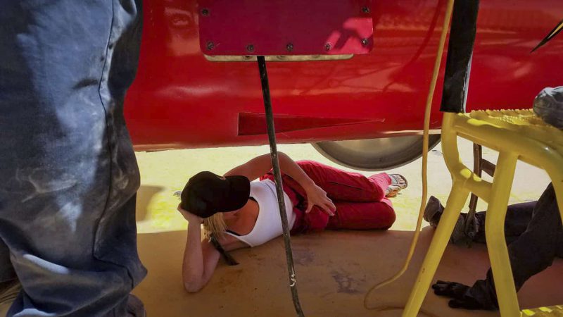Jessi Combs watches crew work on the North American Eagle Project car