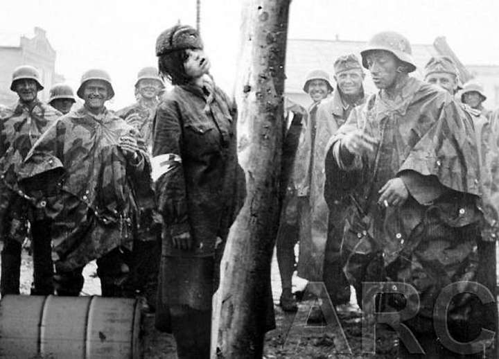 Nazi's hang female medical personnel.