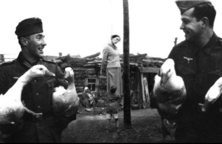 Nazis hang Jewish woman.