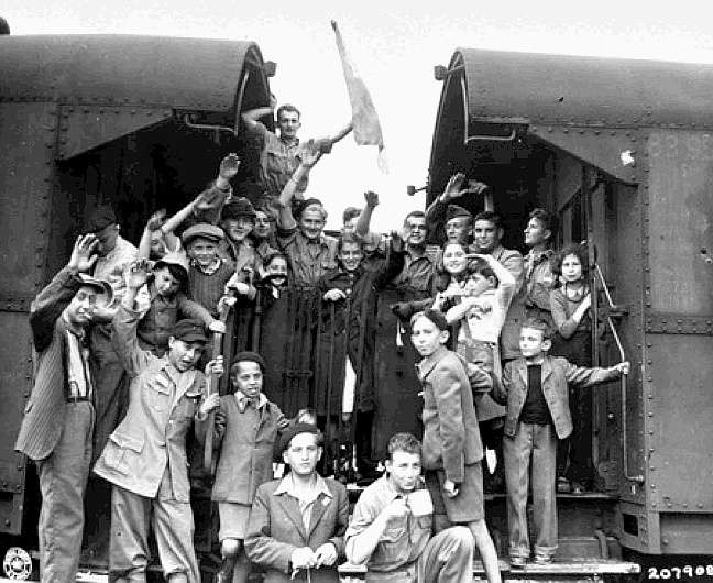 Child orphans leave Buchenwald, bound for France, after the camp is liberated